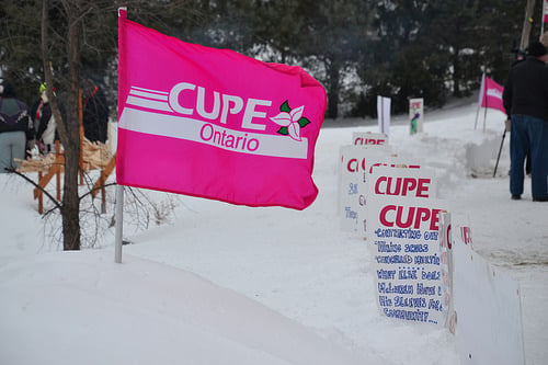 CUPE Ontario Flag standing in the snow