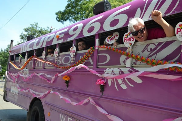 Fred Hahn and others peek their heads outside of the CUPE 966 bus