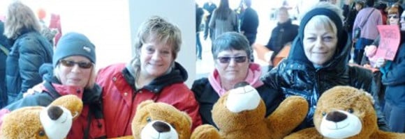 SSWCC workers posing with teddy bears