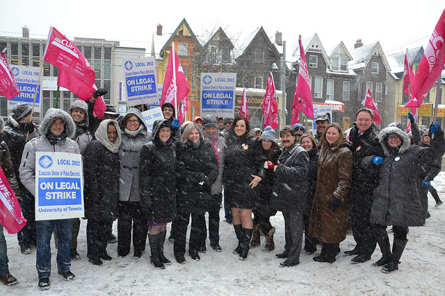 A crowd shot of the CUPE Ontario Executive Board outside in support of CUPE 3902