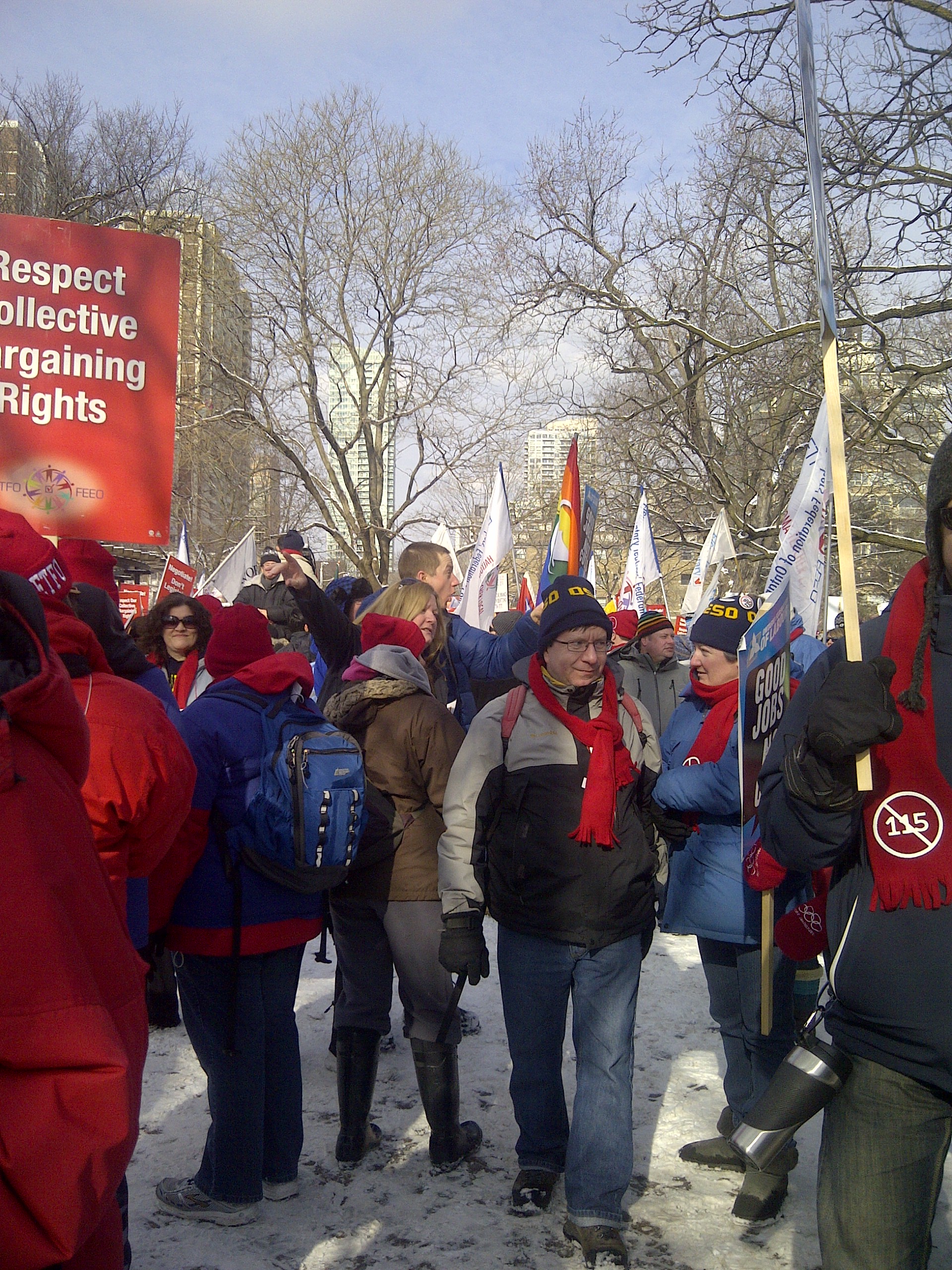 Members stand outside at a rally in Sault Ste. Marie and District