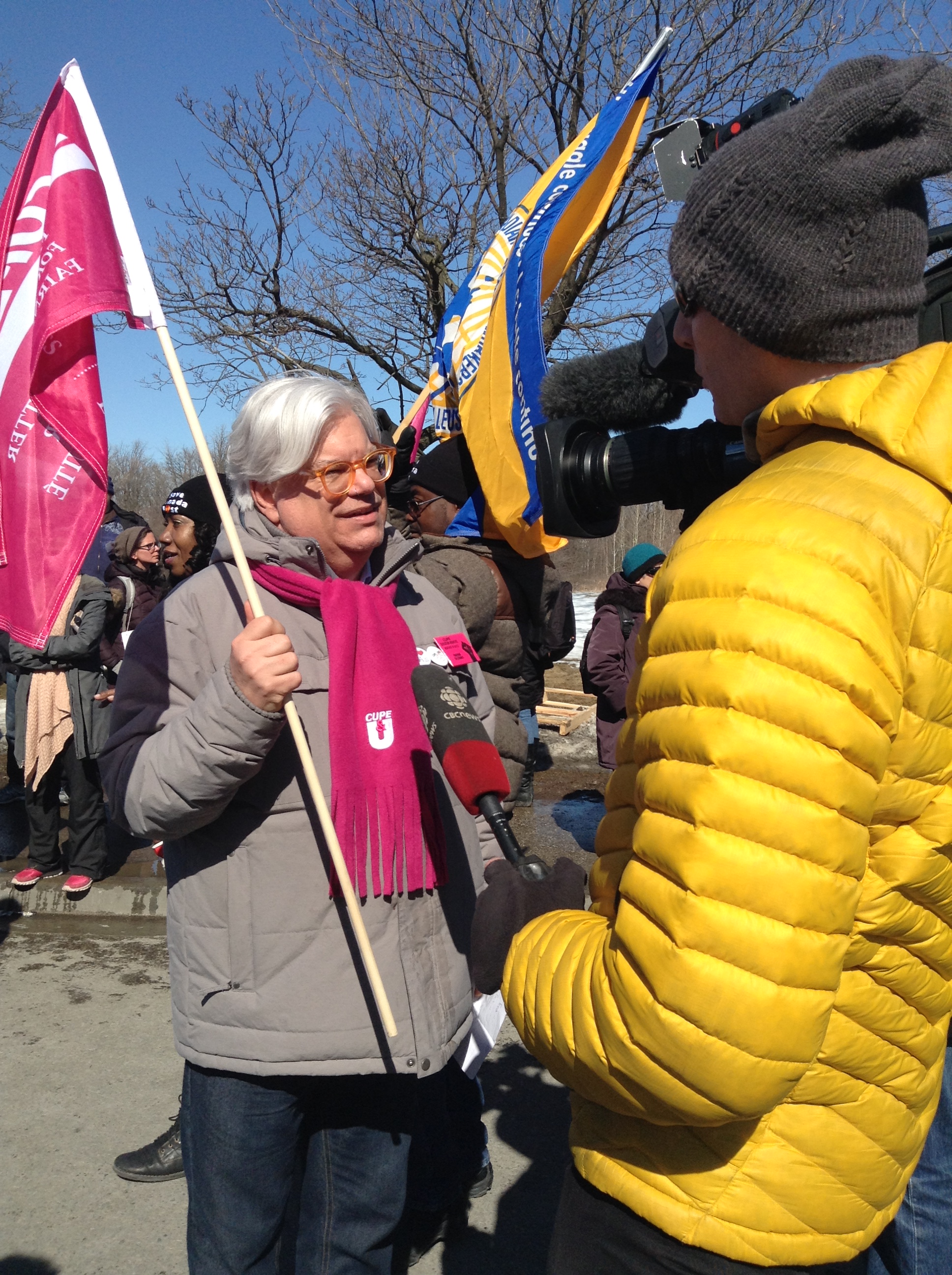 Fred Hahn speaks to the media at a CUPE 3903 Rally