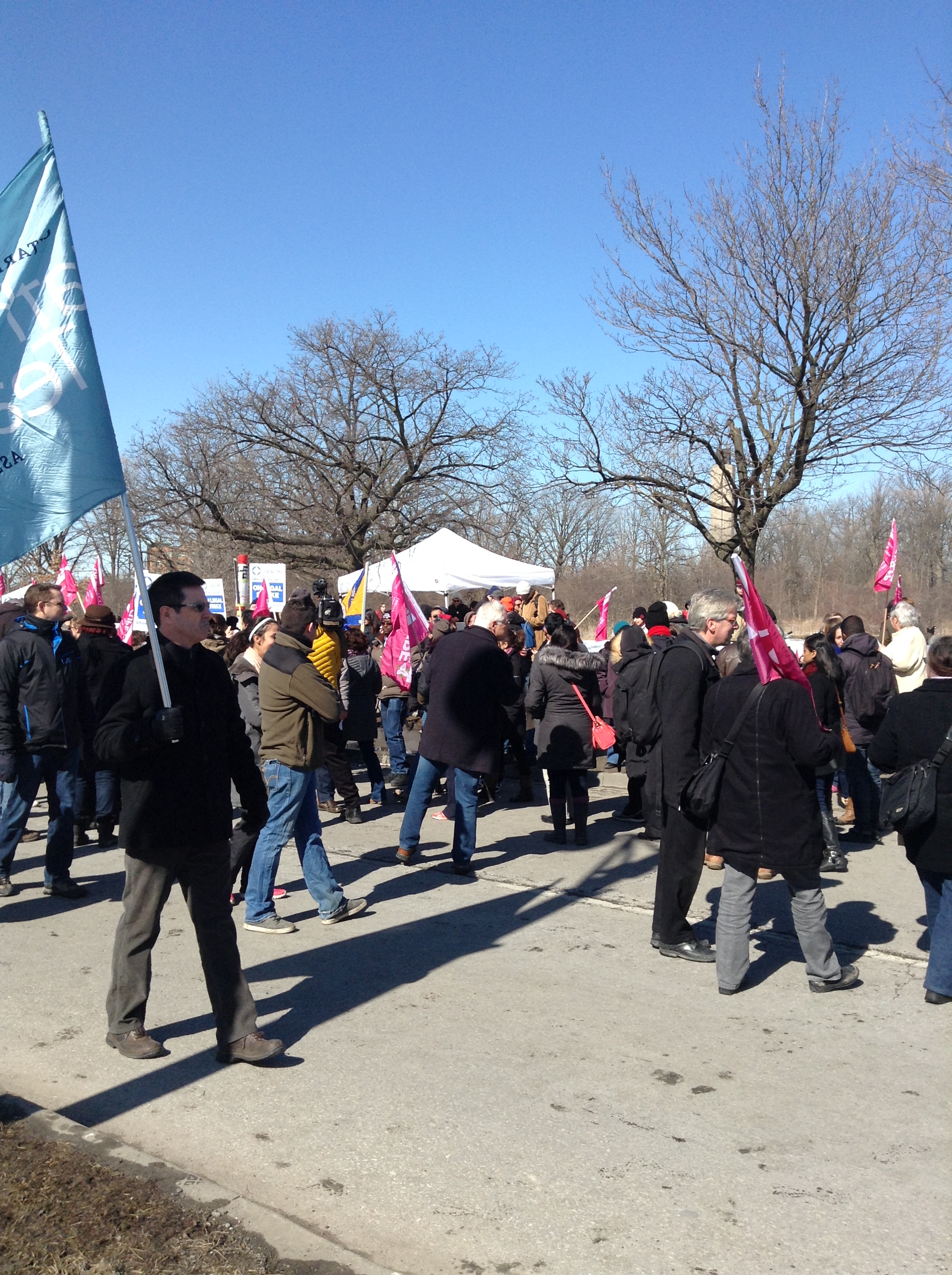 People walking outside at a CUPE 3903 Rally