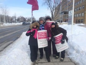 Four people outside in the cold in Sarnia-Lambton