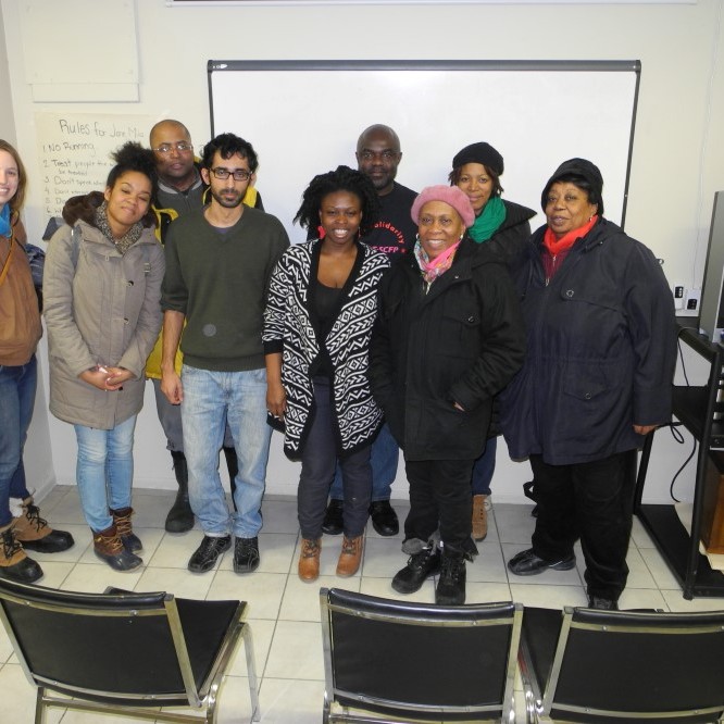 9 people smiling at the camera at the Colour of Labour 2014 event
