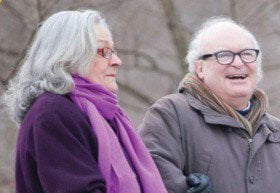 Image of an elderly couple outside smiling
