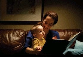 Image of mother reading to her young child