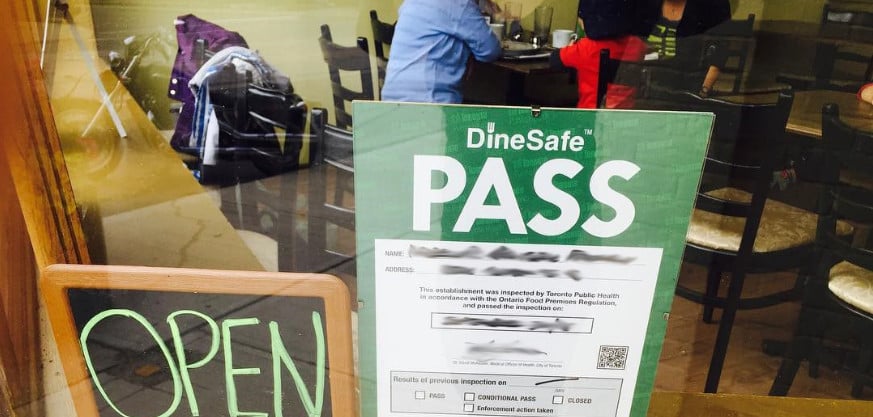 DineSafe PASS placard in window