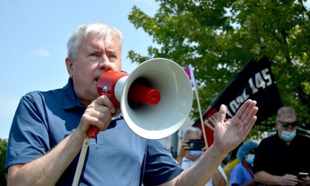 Hurley_Super_Portrait_OCHURally_11Aug2021 Photo shows Michael Hurley with a megaphone.