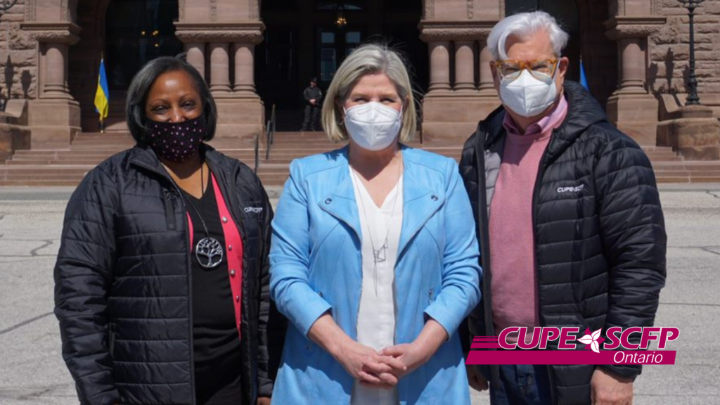 Image shows Yolanda McClean, Andrea Horwath, and Fred Hahn standing outside, wearing face masks, in front of the Ontario legislature.