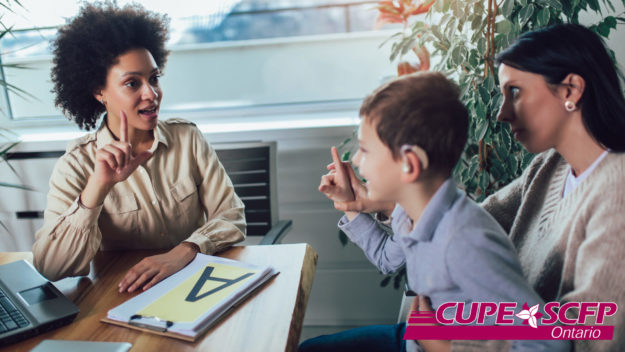 CanadianHearingSociety Child with hearing aids attending ASL